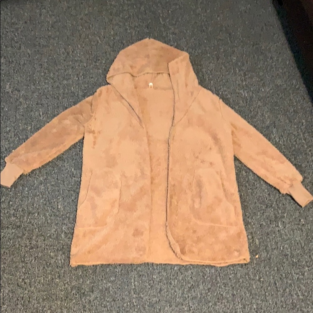 Fuzzy brown sweater runs small this ones a medium